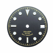 Black, white, and yellow military-style watch dial,