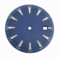 Blue-toned, striped dress watch dial with applied baton hour markers