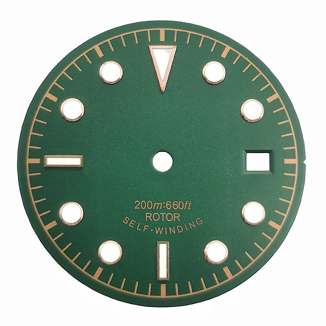 Green and yellow vintage-style diving watch dial with baton and dot markers.