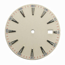 White vertically fluted dress watch dial with applied baton hour markers
